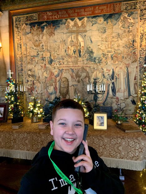 Brady listening to the audio tour while visiting the Biltmore Estate