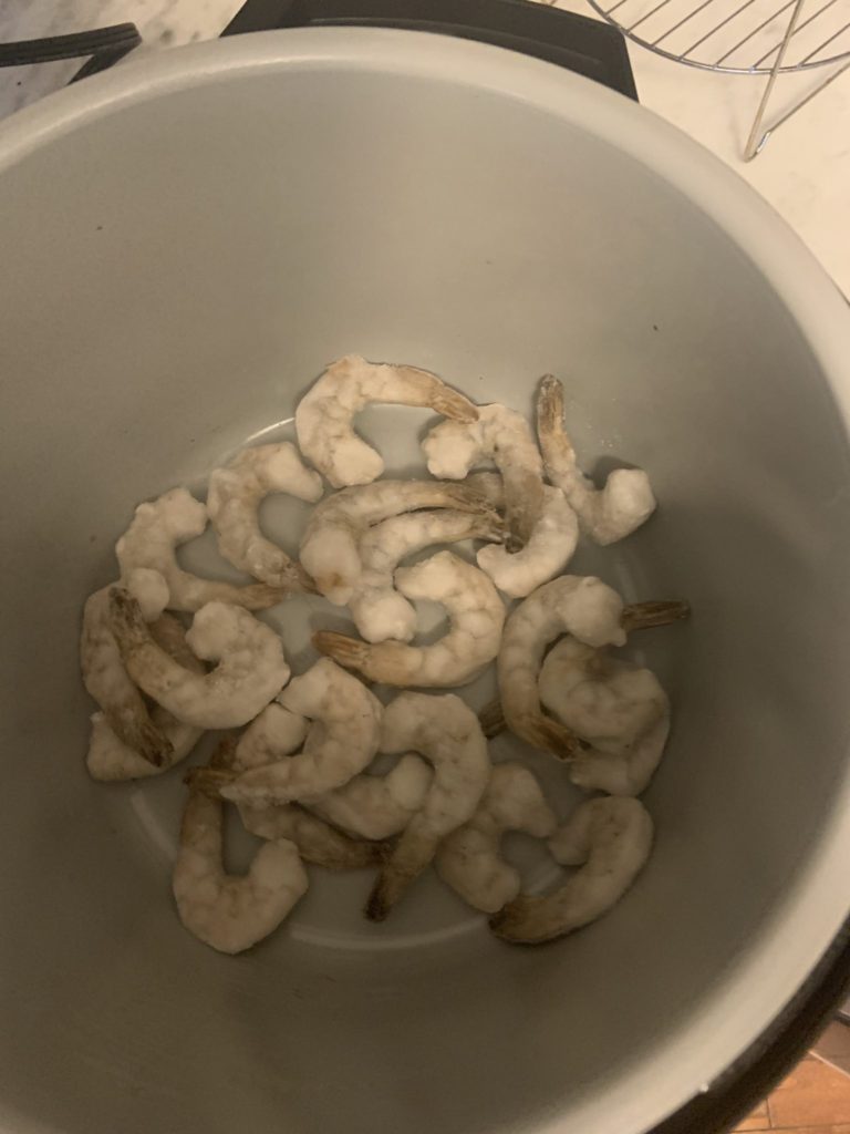Place frozen shrimp into the removable pot
