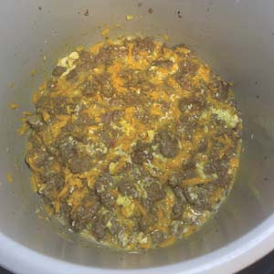 Combine sausage, gravy, eggs, and cheese