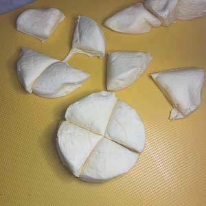 Cut the biscuits into four pieces