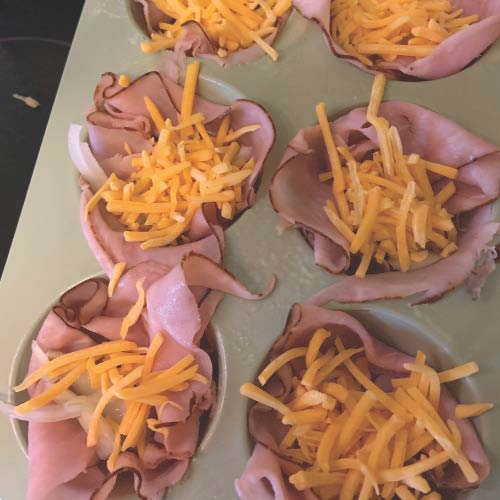 Add filling of your choice to the ham lined muffin tin