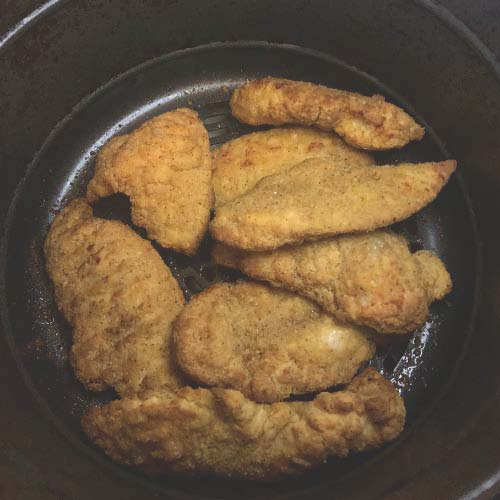 Delicious crispy chicken tenders fully cooked in the air fryer